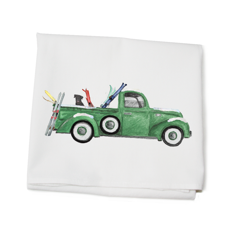 green truck with skis and lab flour sack towel